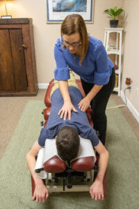 Dr. Miller with Chiropractic patient